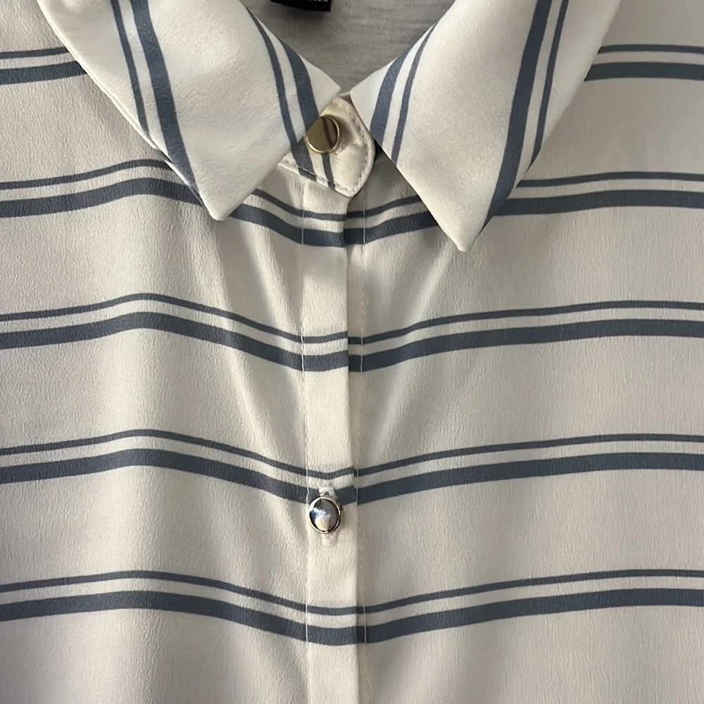 Ann Taylor long sleeved blouse. White with blue stripes and metal buttons. Sm